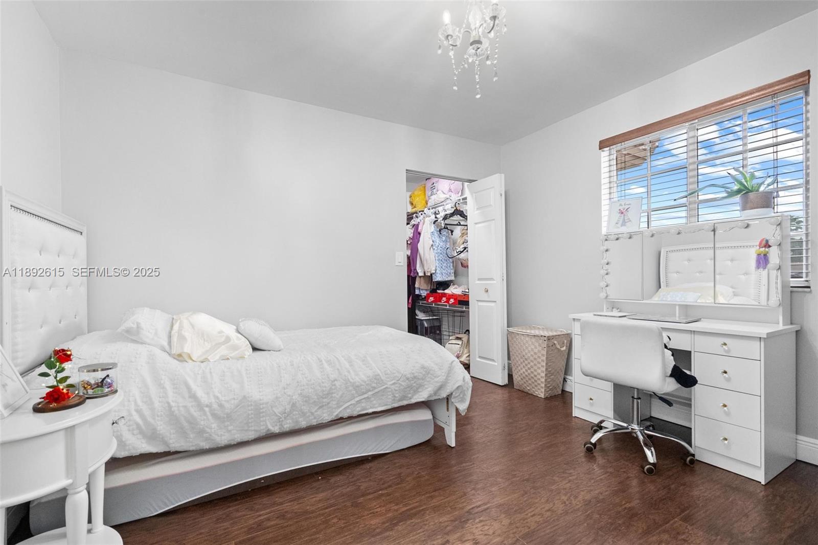 15025 Southwest 141st Terrace Miami, FL 33196 - Photo 17 of 34 a bedroom with a bed and a desk