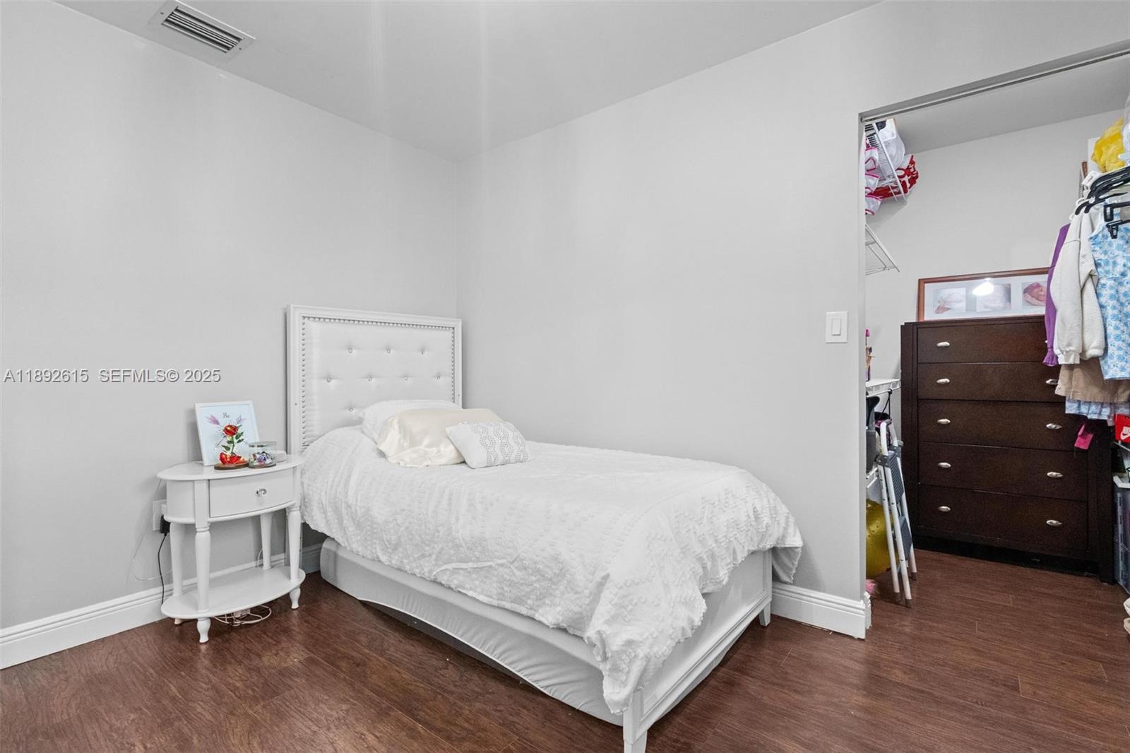 15025 Southwest 141st Terrace Miami, FL 33196 - Photo 18 of 34 a bedroom with a bed and a dresser