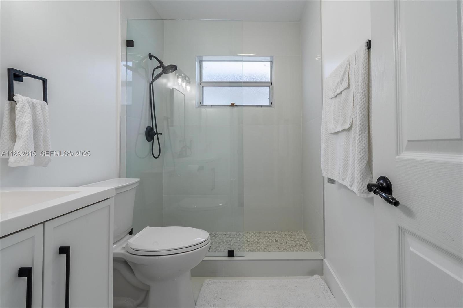 15025 Southwest 141st Terrace Miami, FL 33196 - Photo 20 of 34 a bathroom with a toilet sink and shower
