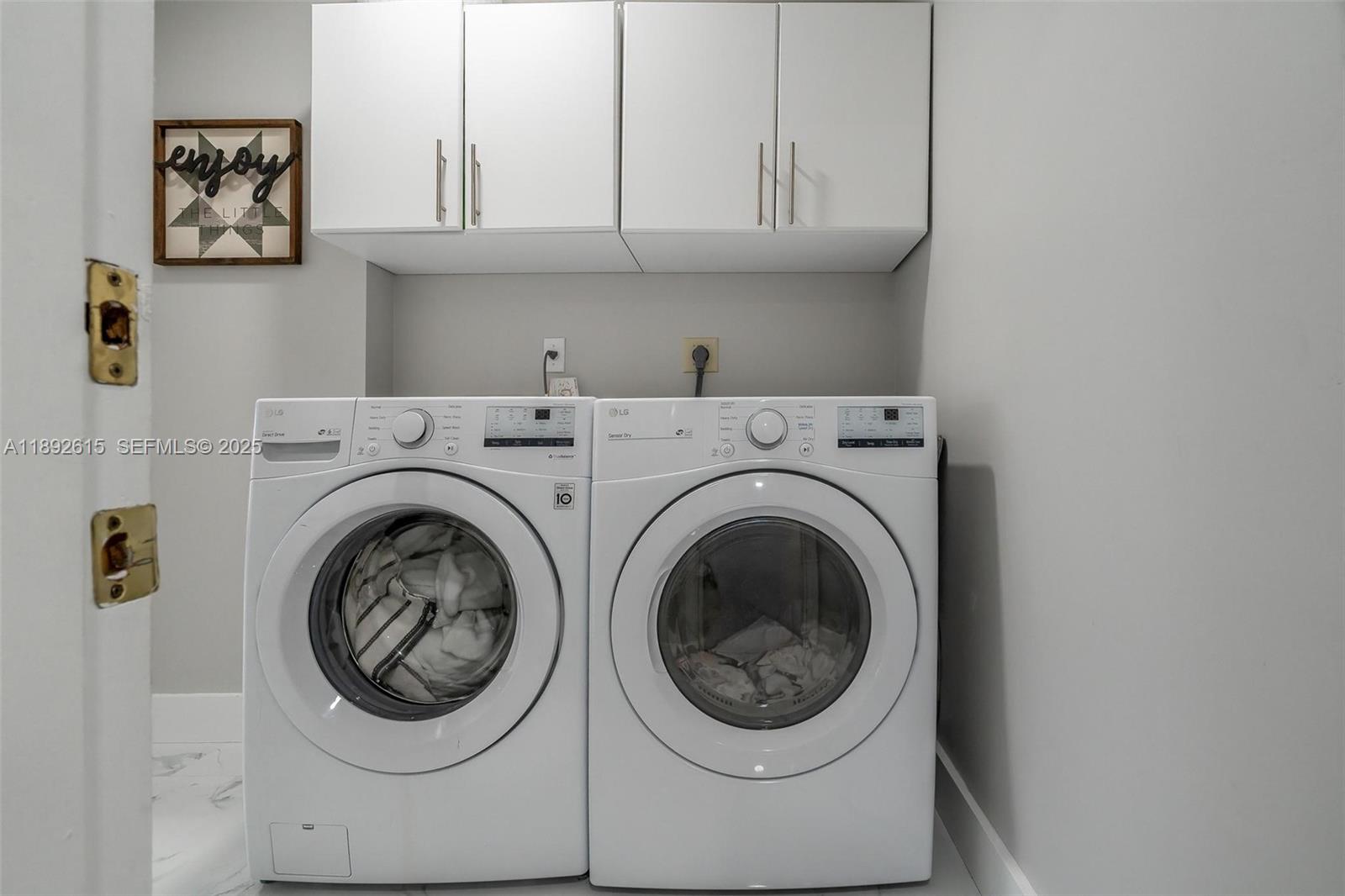 15025 Southwest 141st Terrace Miami, FL 33196 - Photo 24 of 34 a utility room with dryer and washer