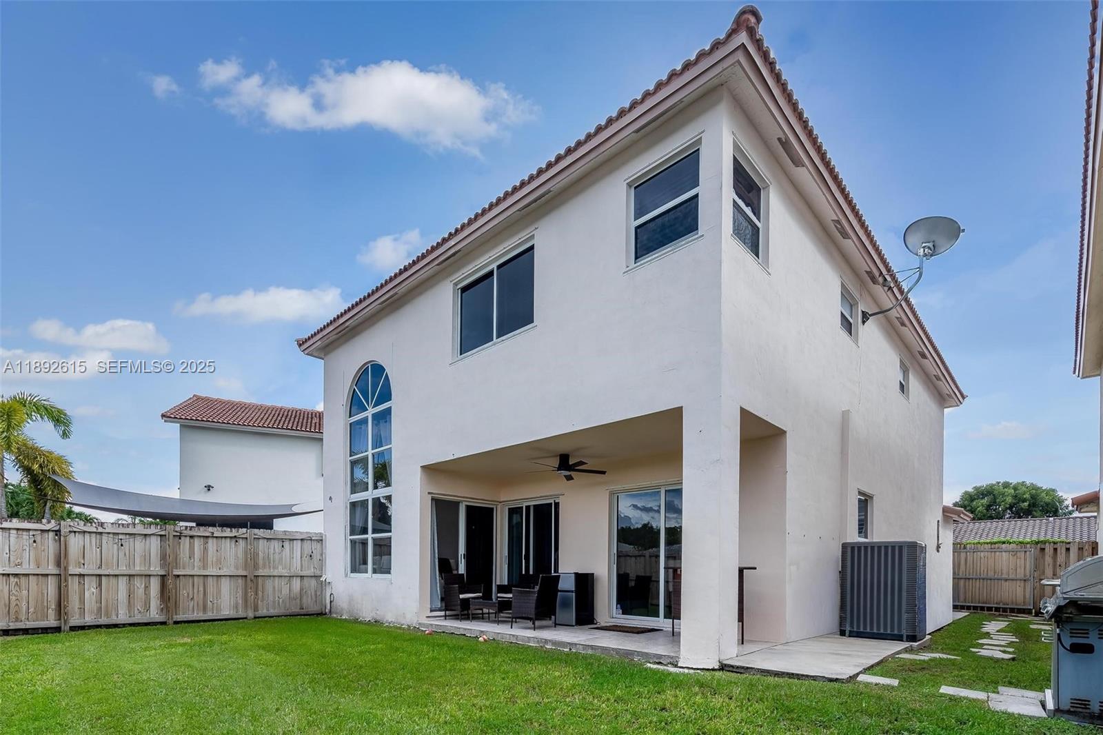 15025 Southwest 141st Terrace Miami, FL 33196 - Photo 30 of 34 a view of an house with backyard porch and furniture