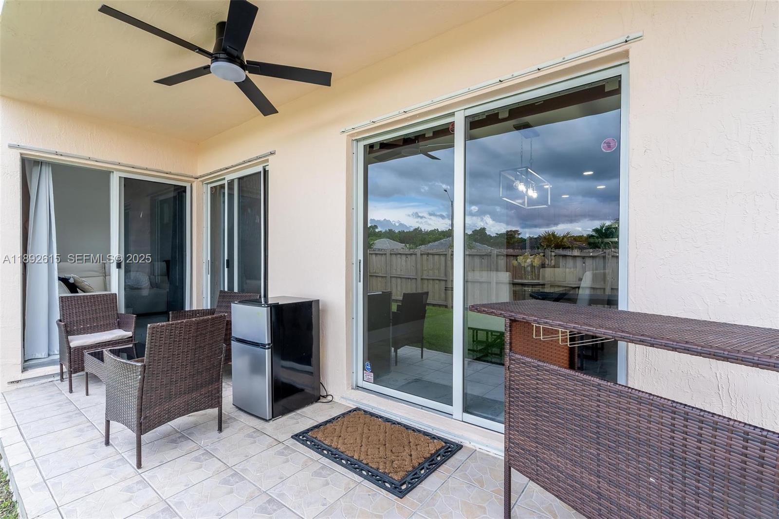 15025 Southwest 141st Terrace Miami, FL 33196 - Photo 32 of 34 a living room with furniture and a window