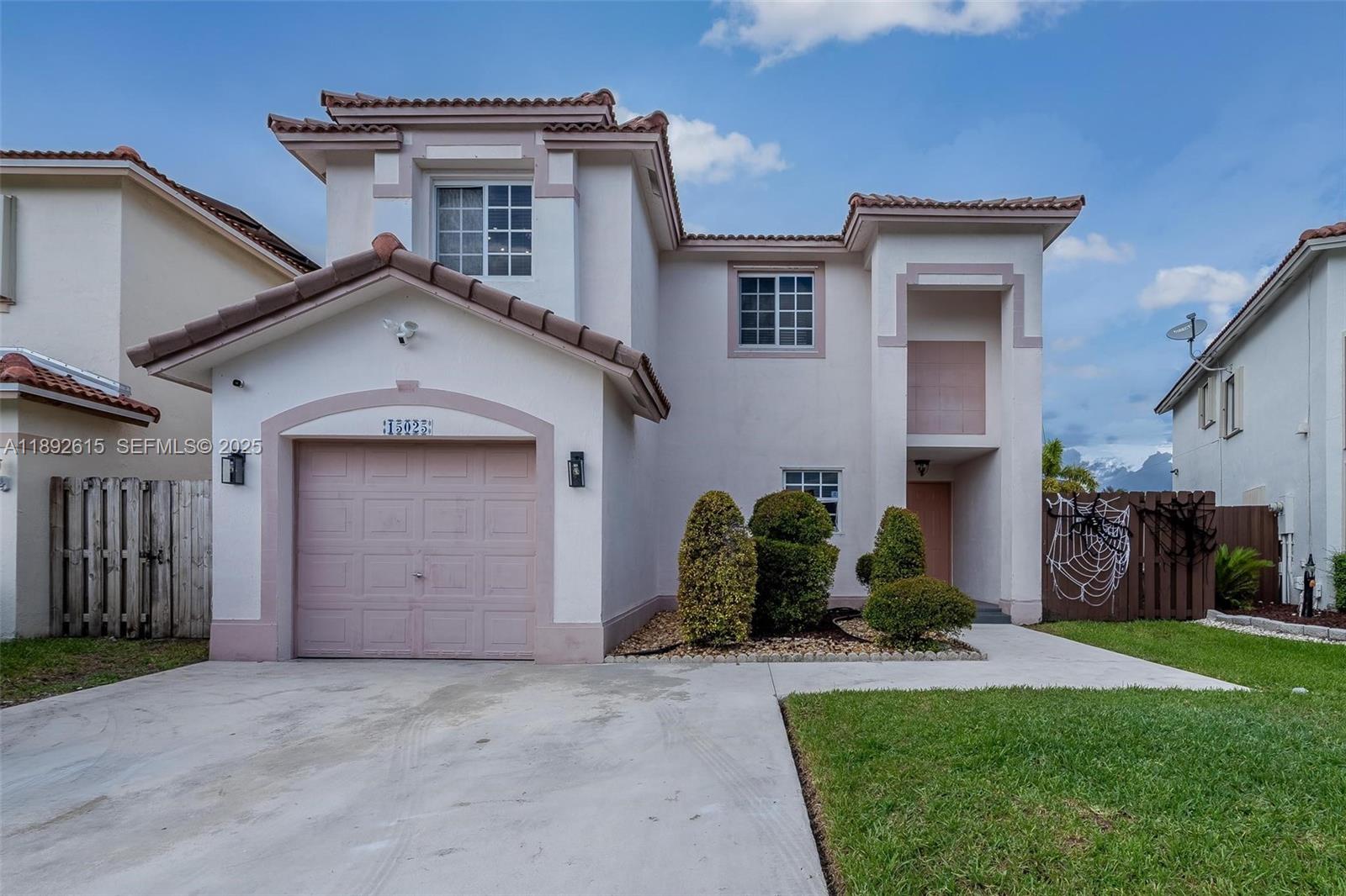 15025 Southwest 141st Terrace Miami, FL 33196 - Photo 34 of 34 a house that has a lot of windows in it