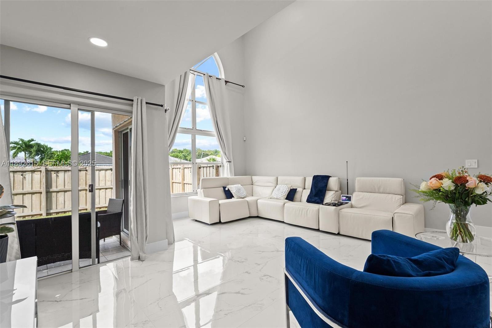 15025 Southwest 141st Terrace Miami, FL 33196 - Photo 6 of 34 a living room with furniture and a potted plant