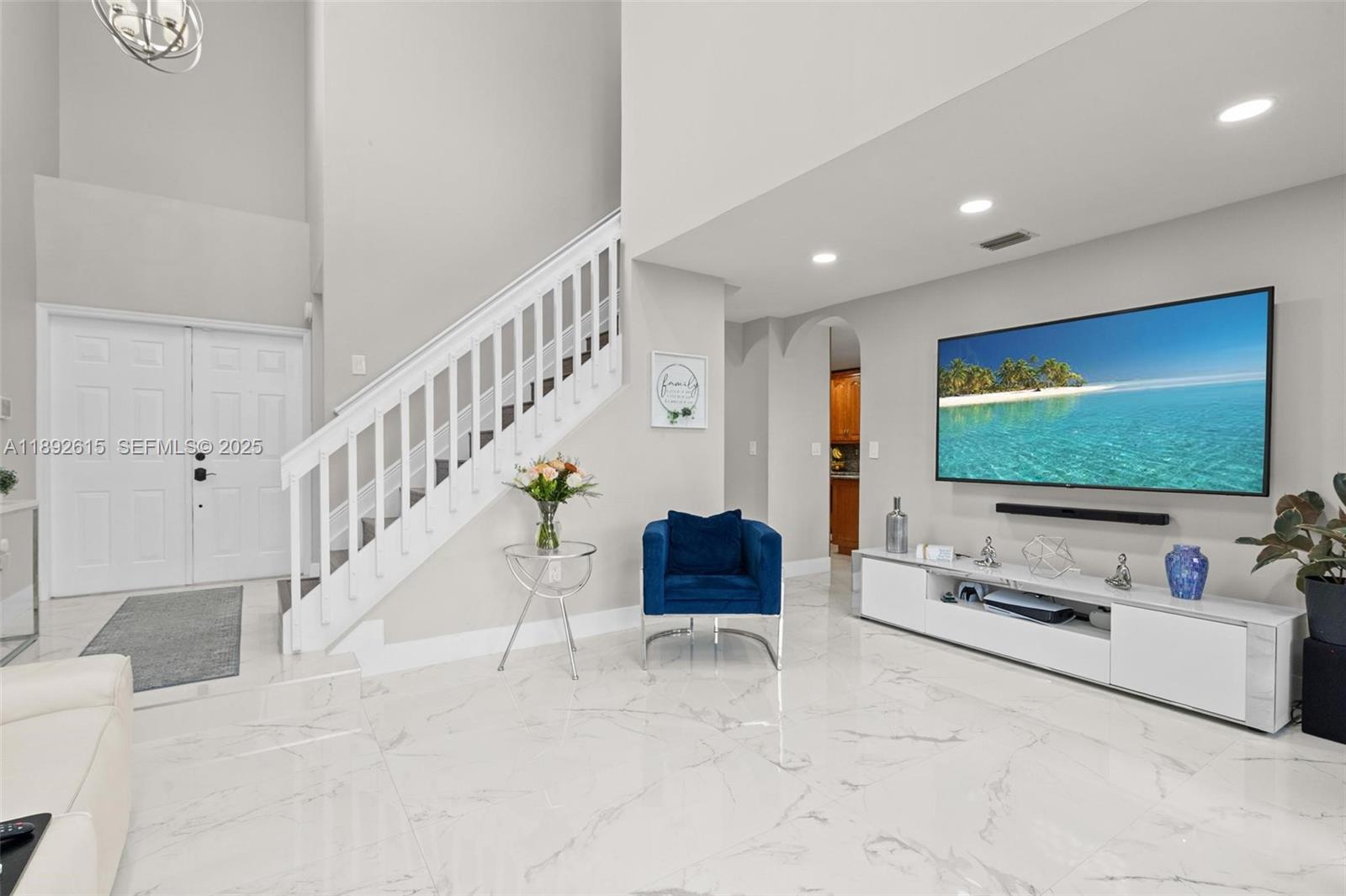 15025 Southwest 141st Terrace Miami, FL 33196 - Photo 7 of 34 a living room with furniture and a flat screen tv