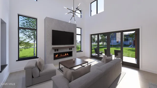 a living room with a hallway and paintings on the wall