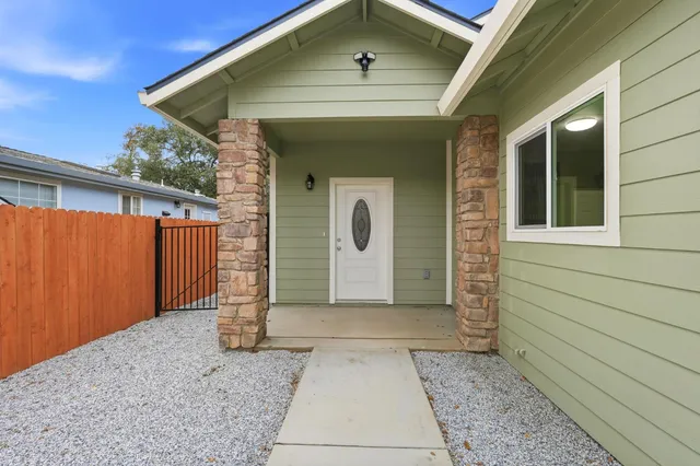 a front view of a house with garage