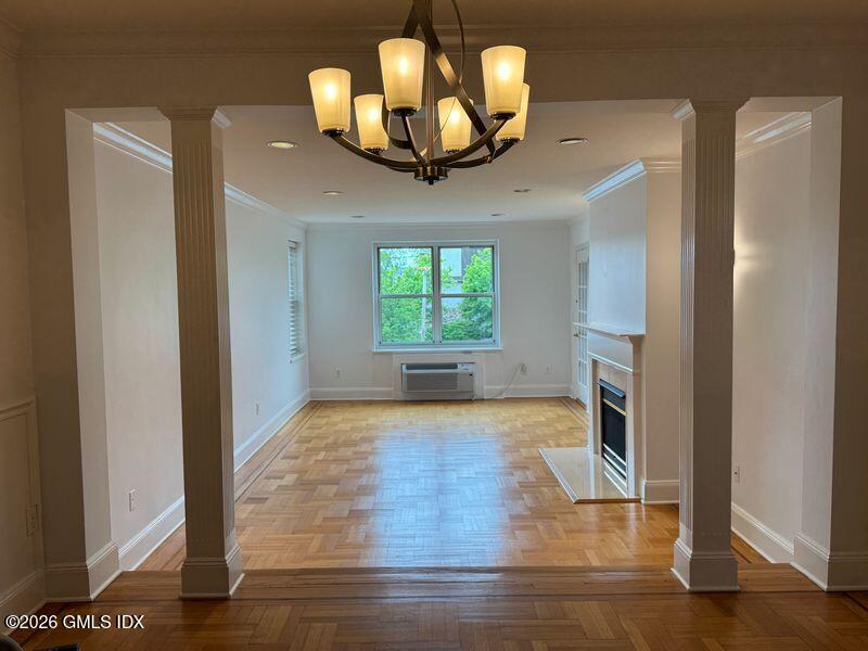 25 West Elm Street, Unit 40 Greenwich, CT 06830 - Photo 5 of 28 a view of a livingroom with a window and a chandelier