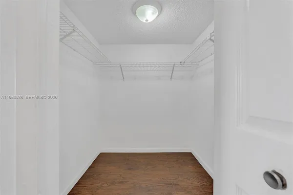 a bathroom with a shower and a glass door