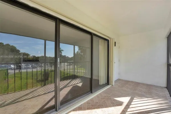 a view of balcony with yard