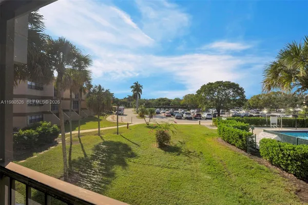 a view of a lake with a house in the background