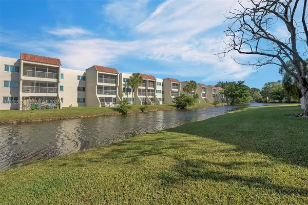 a view of backyard with swimming pool