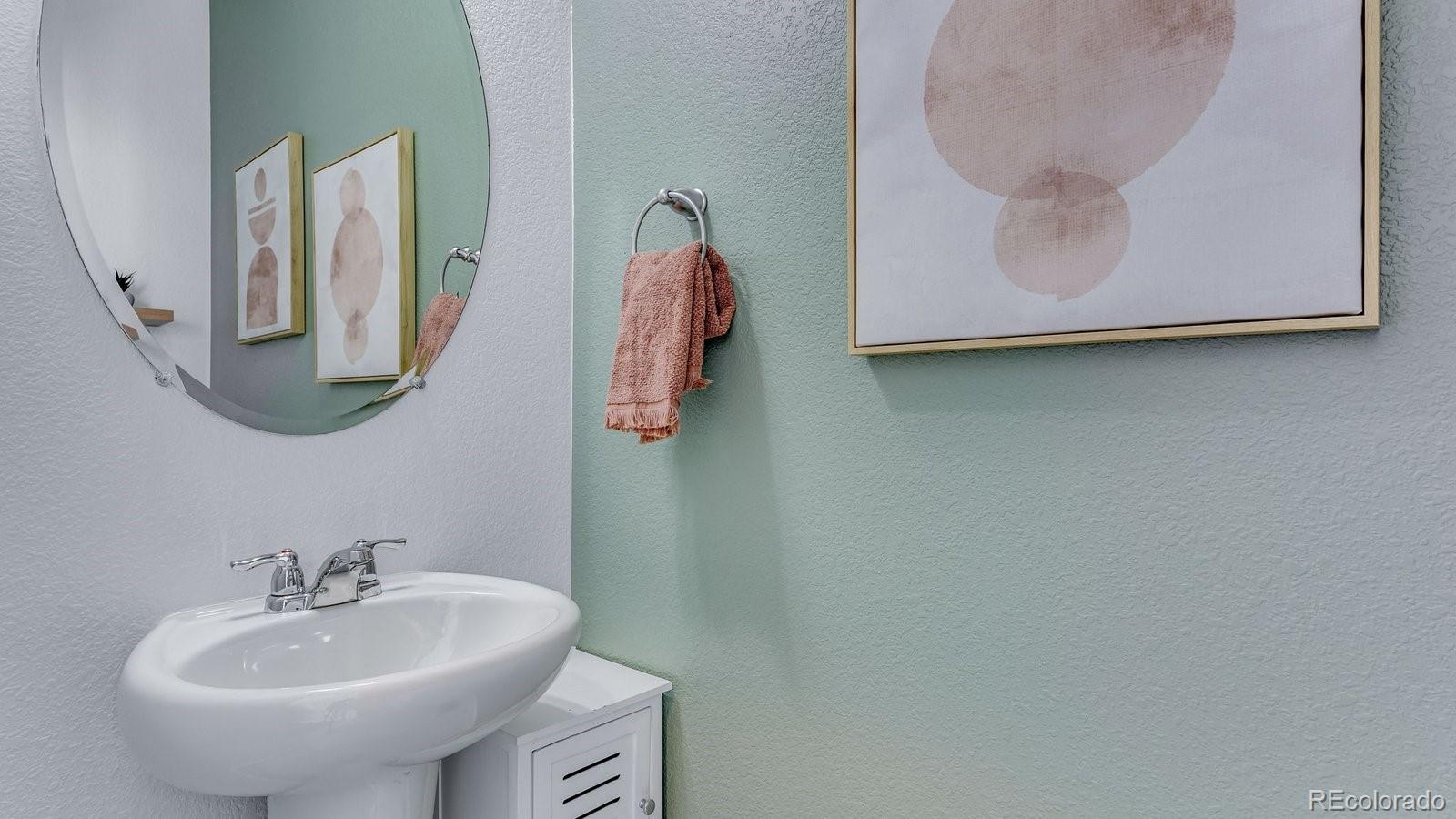 799 Ayrshire Road Johnstown, CO 80534 - Photo 17 of 36 a bathroom with a sink and a mirror