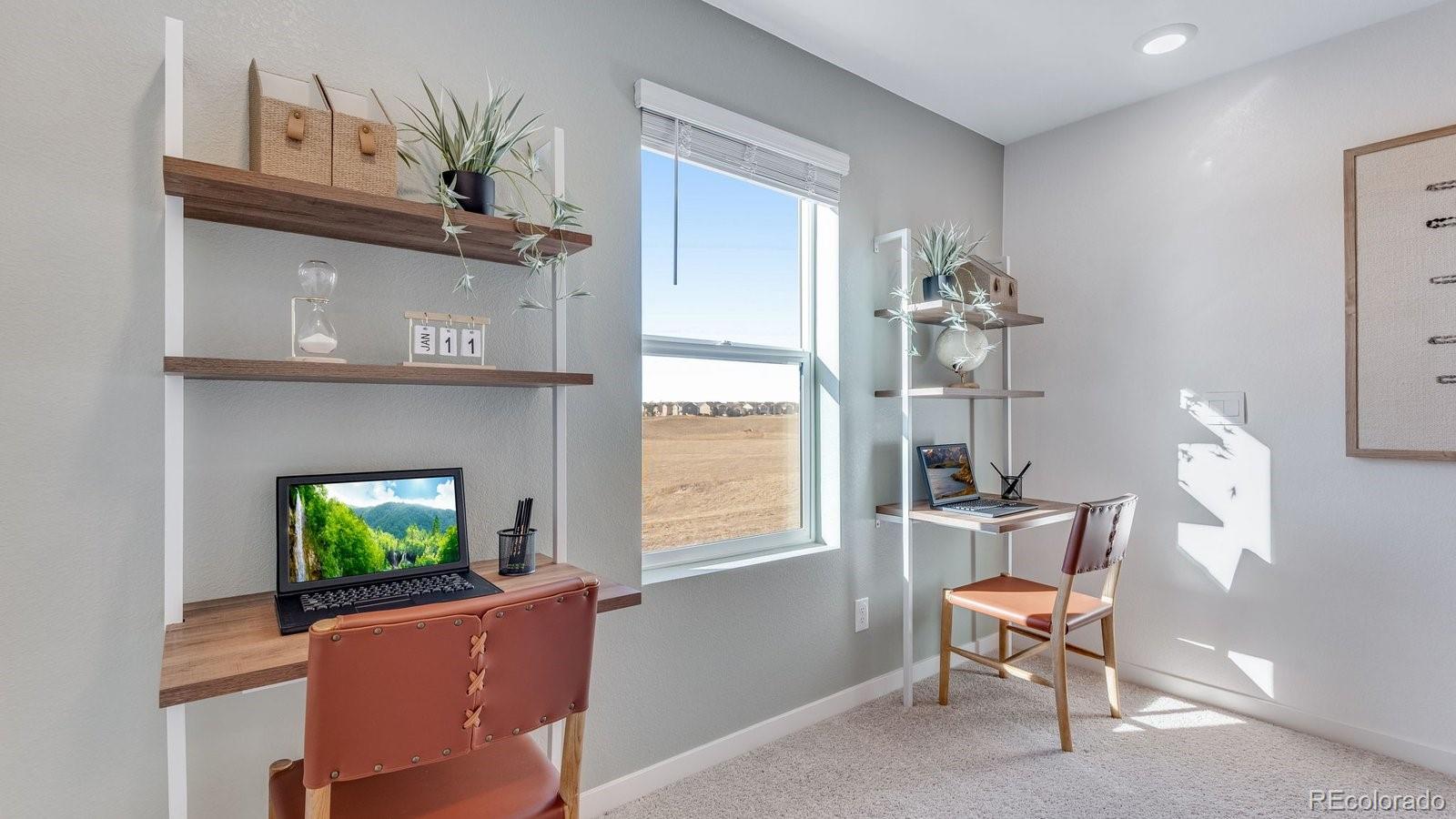 799 Ayrshire Road Johnstown, CO 80534 - Photo 18 of 36 a living room with furniture a window and a fireplace