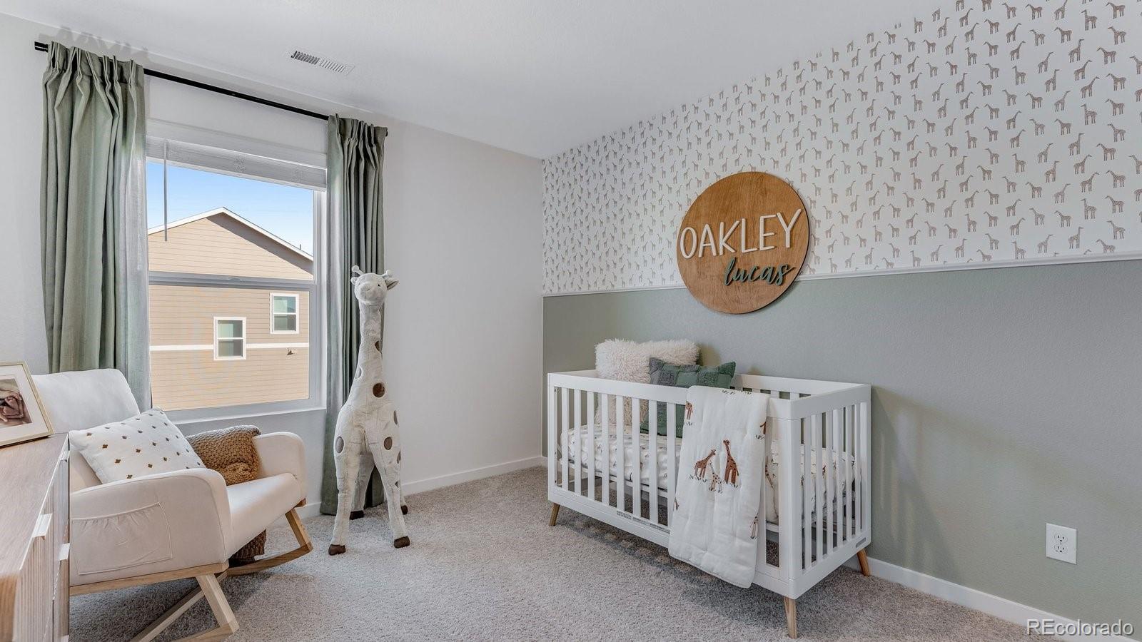 799 Ayrshire Road Johnstown, CO 80534 - Photo 20 of 36 a view of a room with furniture and baby bed