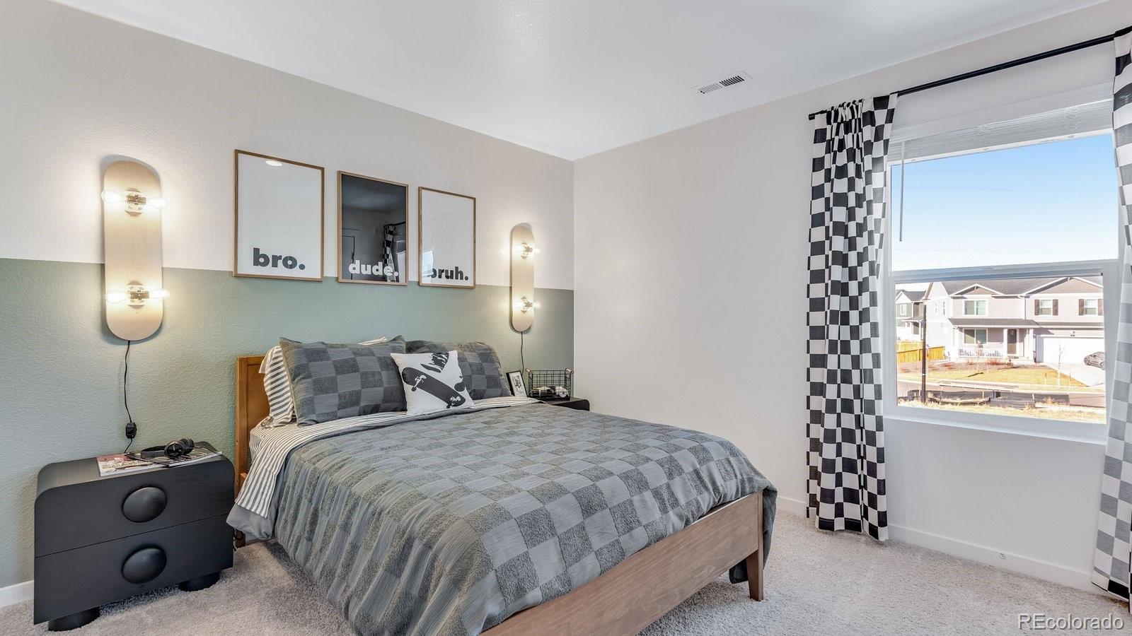 799 Ayrshire Road Johnstown, CO 80534 - Photo 26 of 36 a bedroom with a bed and a window