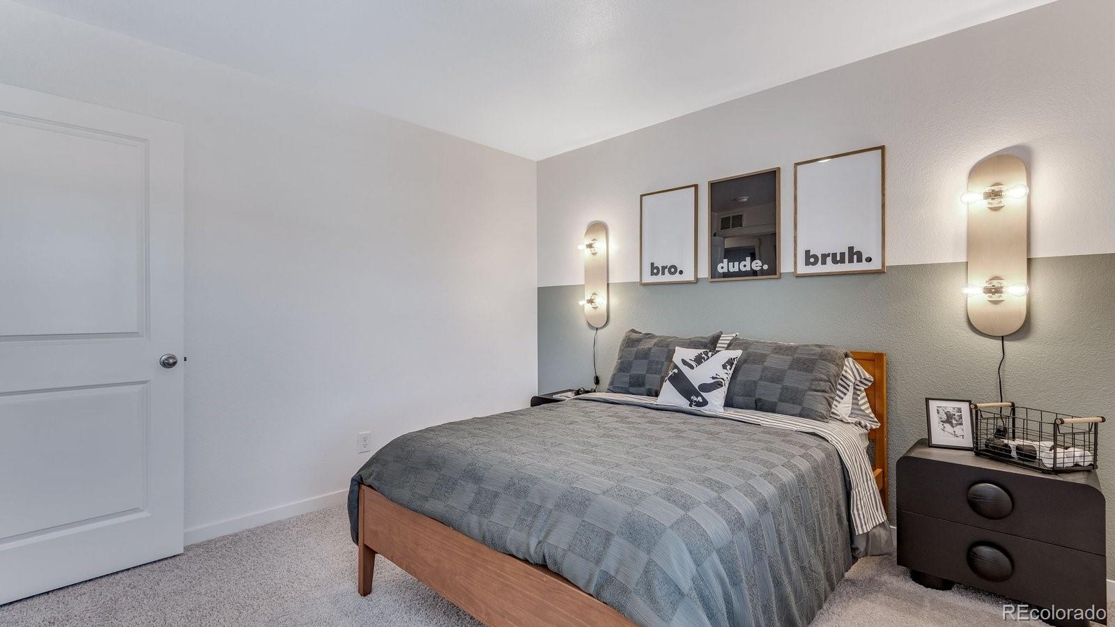 799 Ayrshire Road Johnstown, CO 80534 - Photo 28 of 36 a bedroom with a bed and lamp