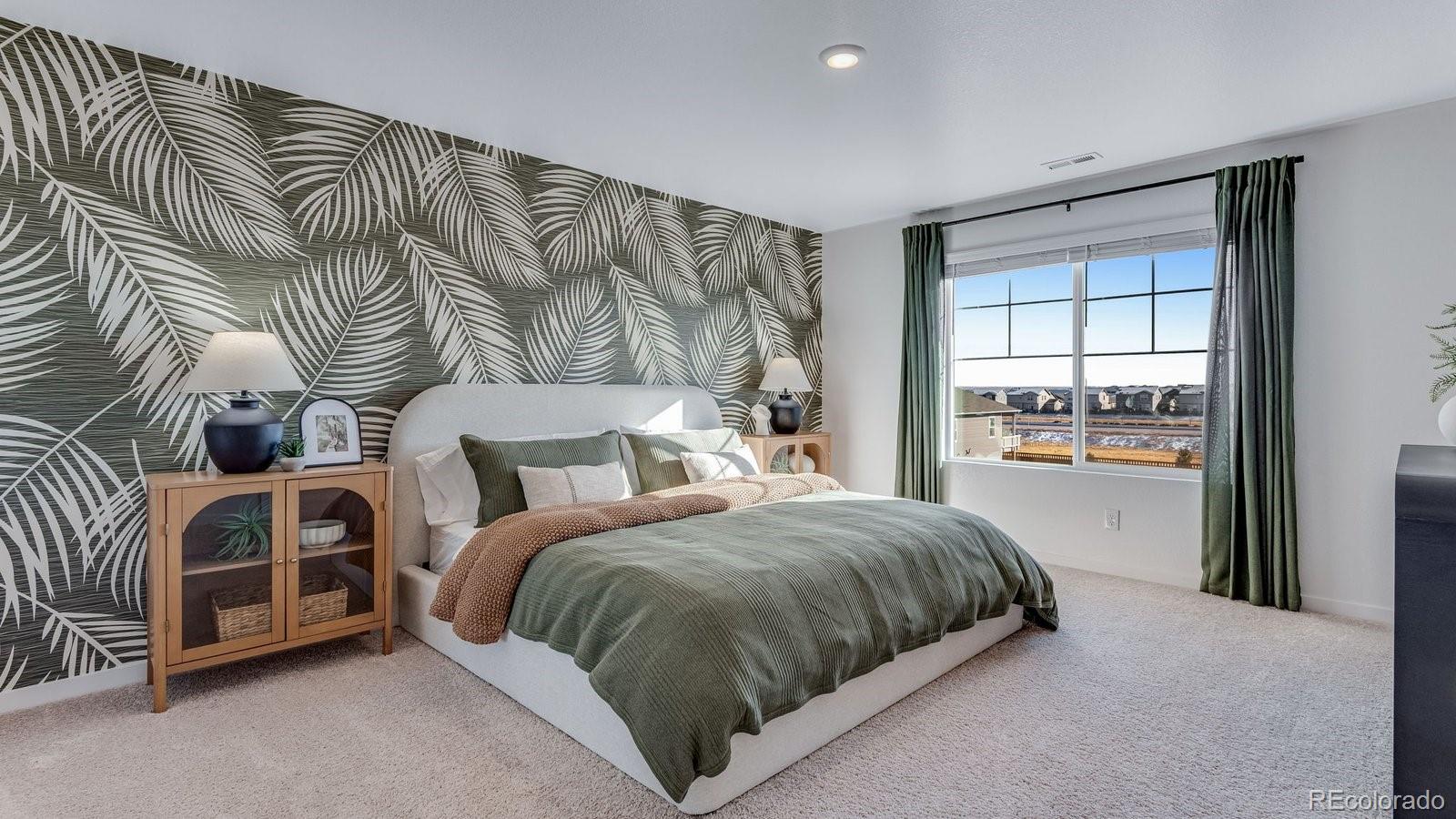 799 Ayrshire Road Johnstown, CO 80534 - Photo 29 of 36 a spacious bedroom with a bed and a window