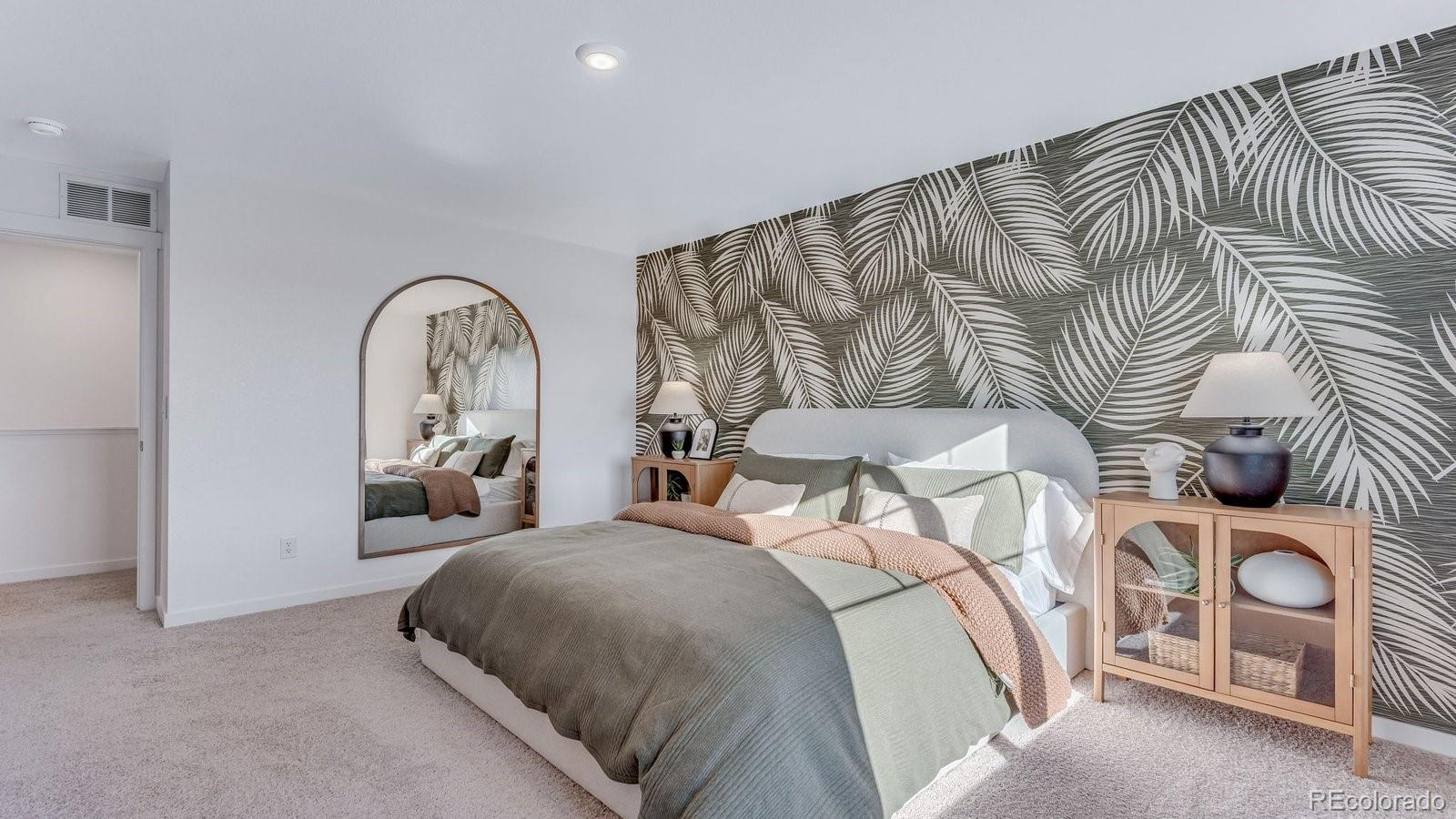 799 Ayrshire Road Johnstown, CO 80534 - Photo 32 of 36 a bed room with a bed and a painting on the wall