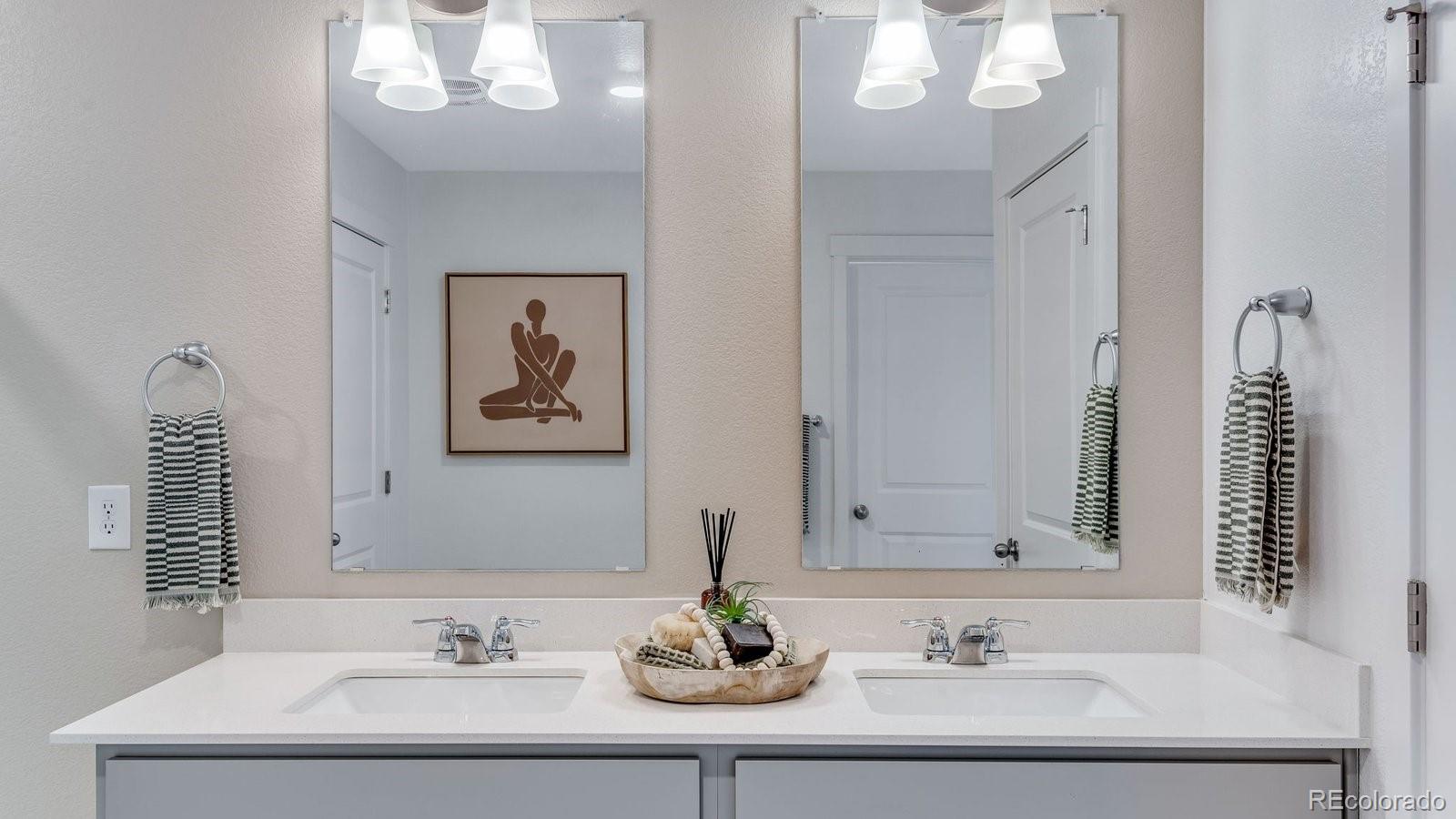 799 Ayrshire Road Johnstown, CO 80534 - Photo 34 of 36 a bathroom with a sink and a mirror