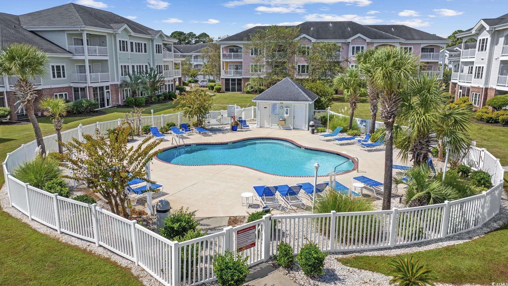 4846 Carnation Circle, Unit 103 Myrtle Beach, SC 29577 - Photo 22 of 31 Community pool with a patio