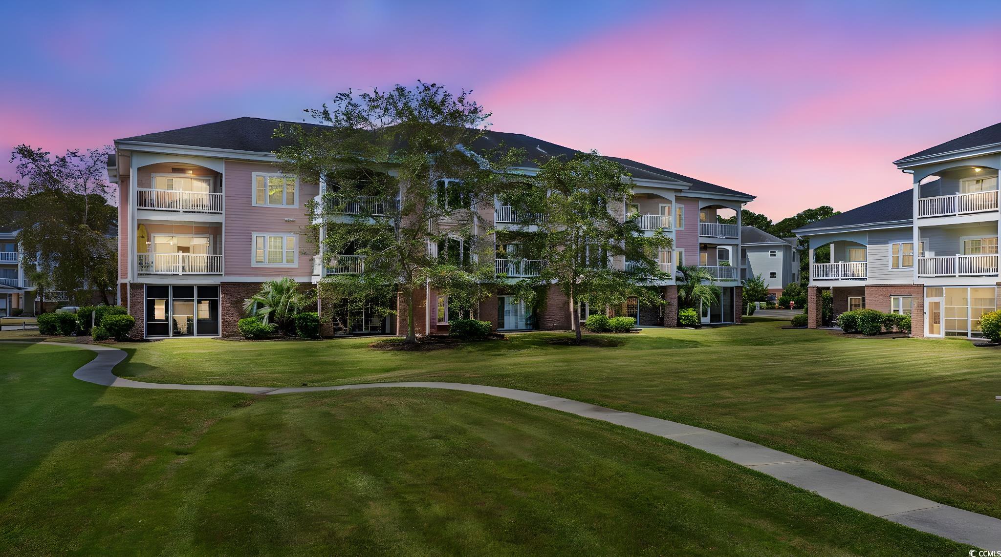 4846 Carnation Circle, Unit 103 Myrtle Beach, SC 29577 - Photo 26 of 31 Surrounding community with a yard