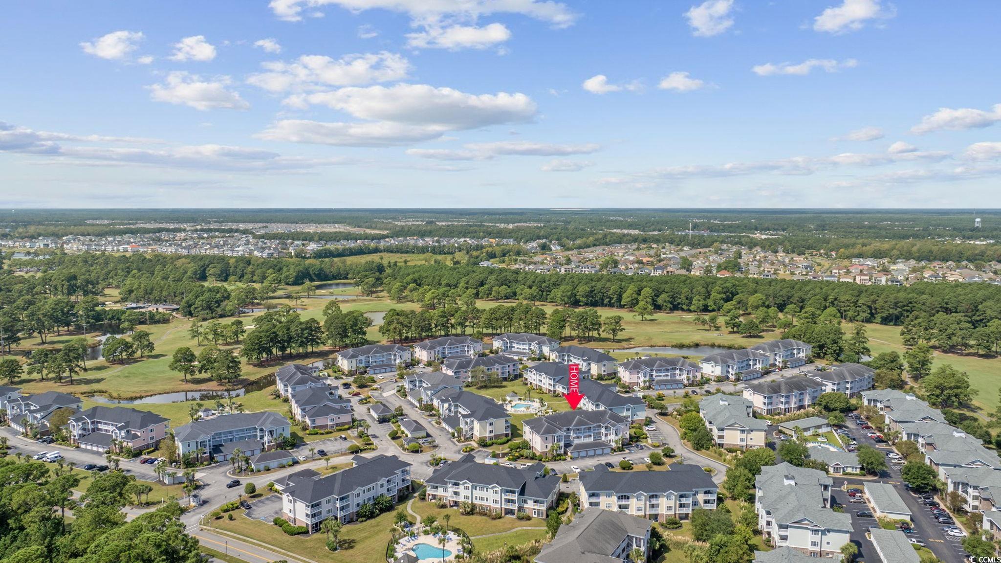 4846 Carnation Circle, Unit 103 Myrtle Beach, SC 29577 - Photo 27 of 31 View of property location featuring nearby suburban area, a golf club, and a large body of water