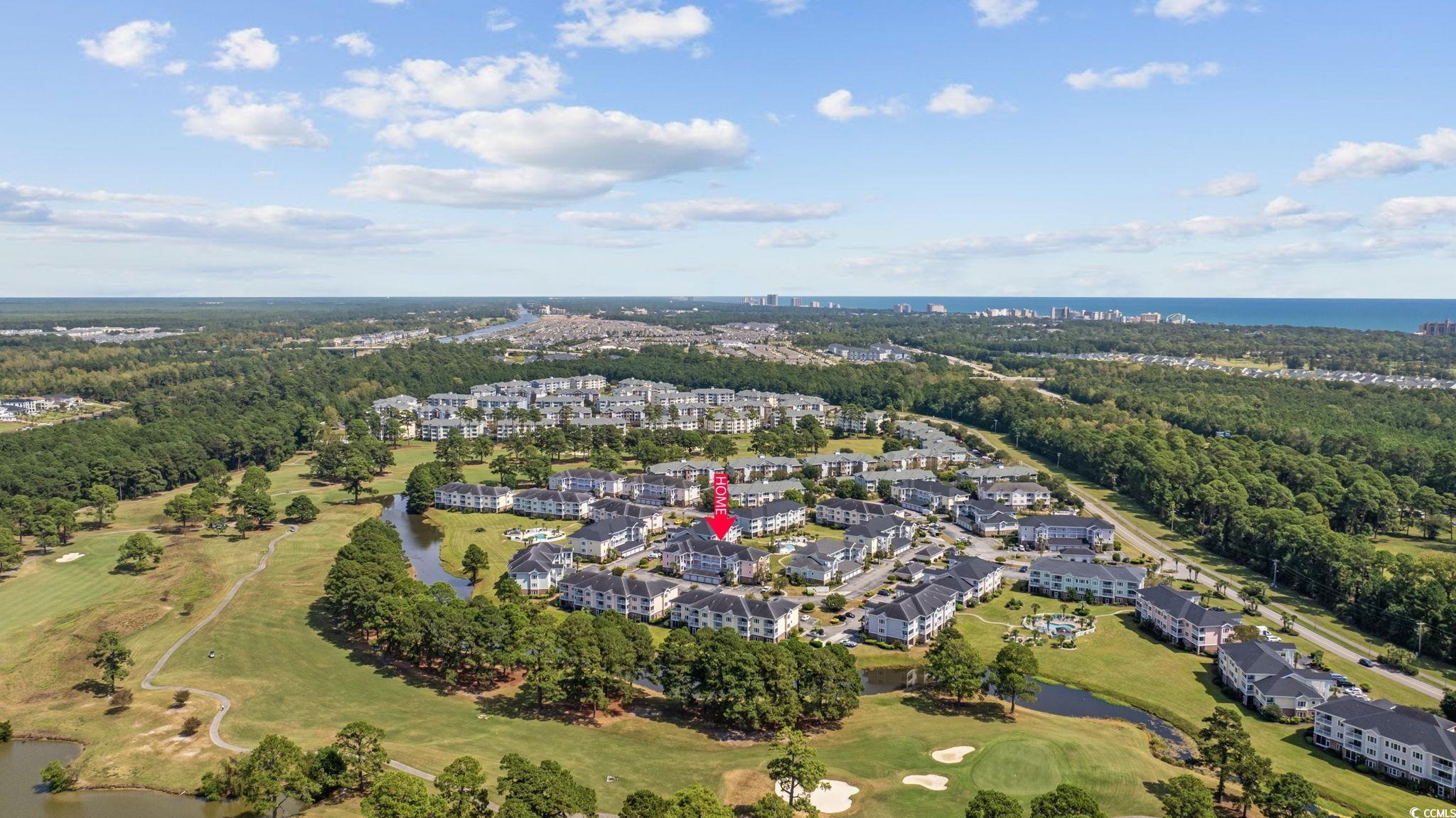 4846 Carnation Circle, Unit 103 Myrtle Beach, SC 29577 - Photo 31 of 31 Aerial view of property's location with a large body of water and nearby suburban area