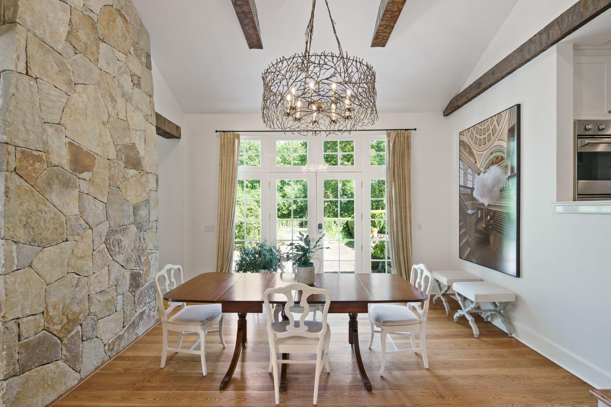 231 Cannon Road Wilton, CT 06897 - Photo 12 of 48 a view of a dining room with furniture a chandelier and wooden floor