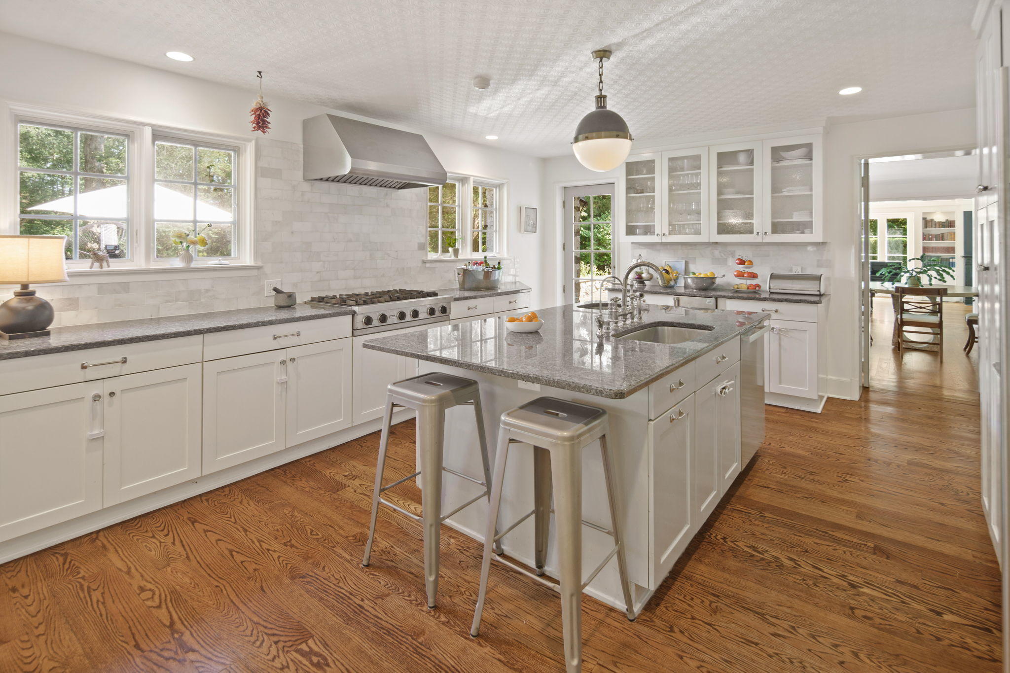 231 Cannon Road Wilton, CT 06897 - Photo 15 of 48 a kitchen with sink stove and cabinets