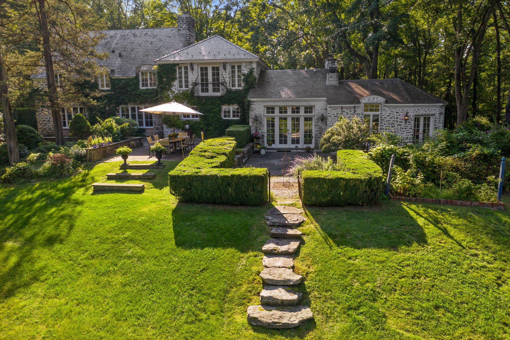 231 Cannon Road Wilton, CT 06897 - Photo 2 of 48 a front view of a house with garden