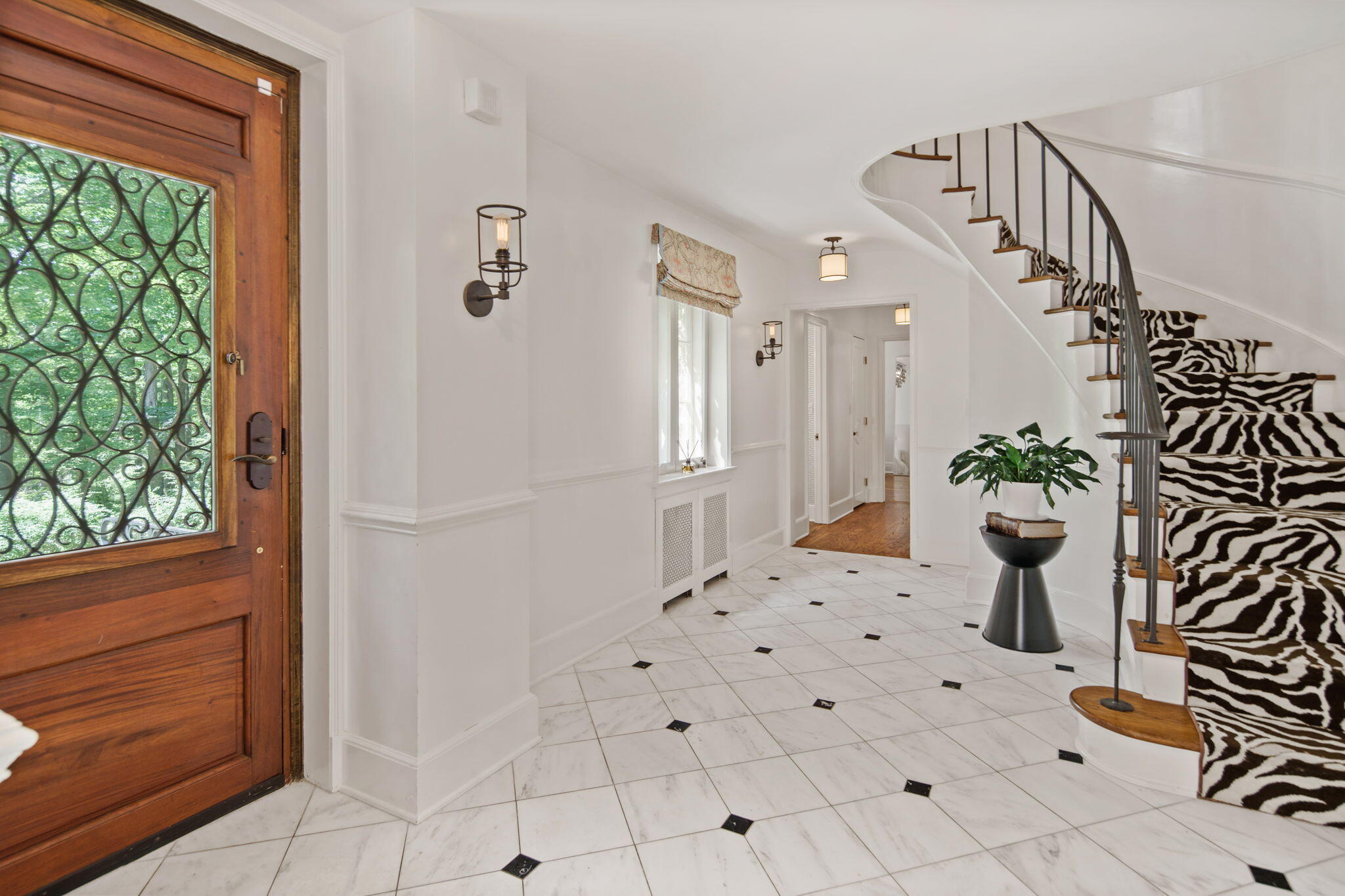 231 Cannon Road Wilton, CT 06897 - Photo 29 of 48 a view of a hallway with wooden floor and windows