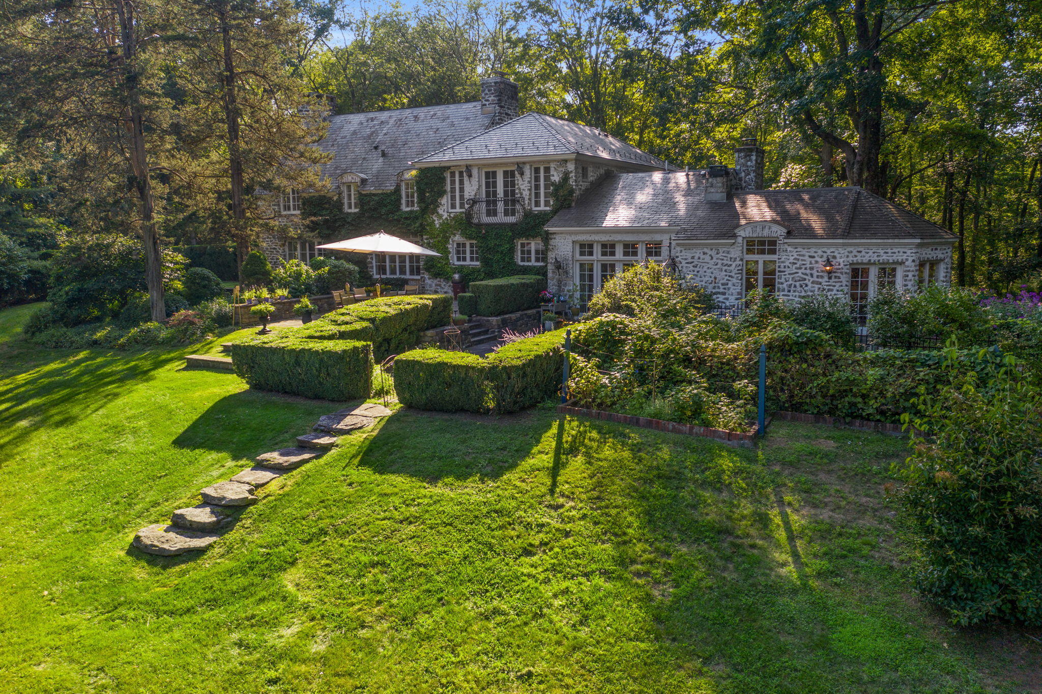 231 Cannon Road Wilton, CT 06897 - Photo 39 of 48 a front view of a house with garden