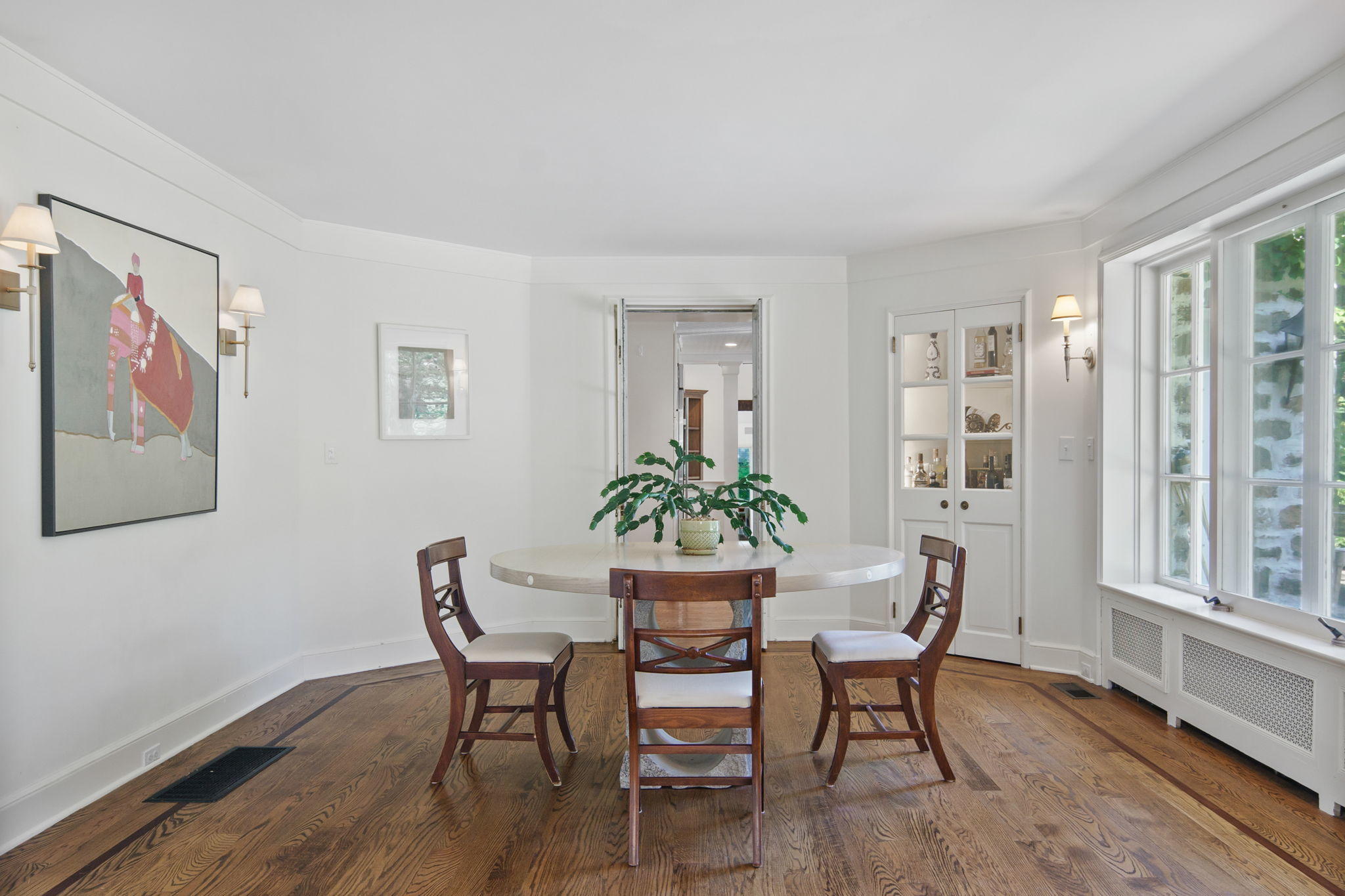 231 Cannon Road Wilton, CT 06897 - Photo 6 of 48 a view of a dining room with furniture window and wooden floor