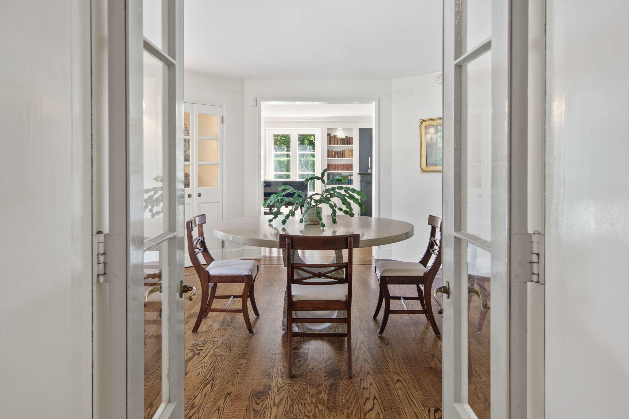 231 Cannon Road Wilton, CT 06897 - Photo 9 of 48 a view of a dining room with furniture and wooden floor