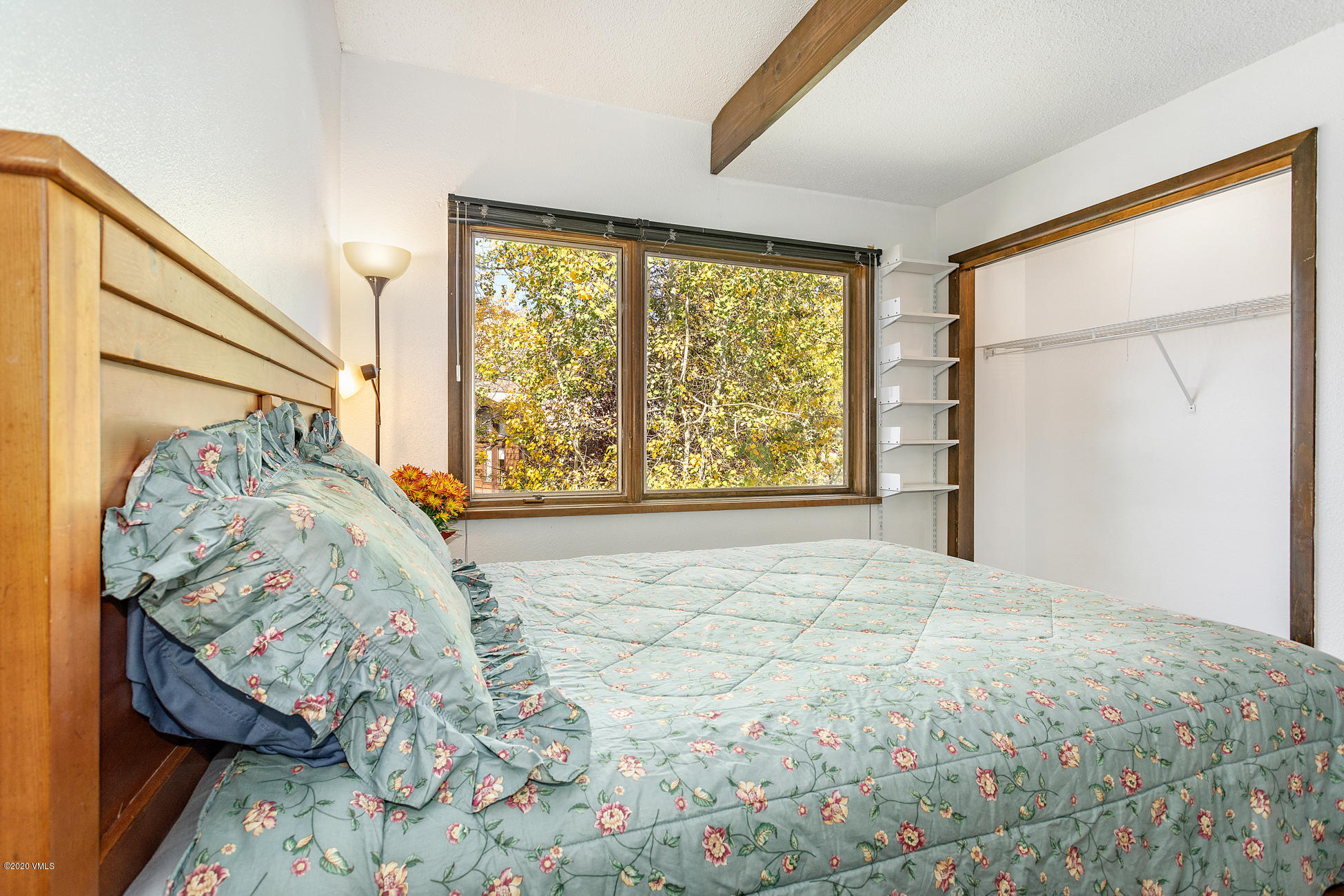 225 Gopher Road, Unit H54 Avon, CO 81620 - Photo 12 of 33 a bedroom with a bed and a window