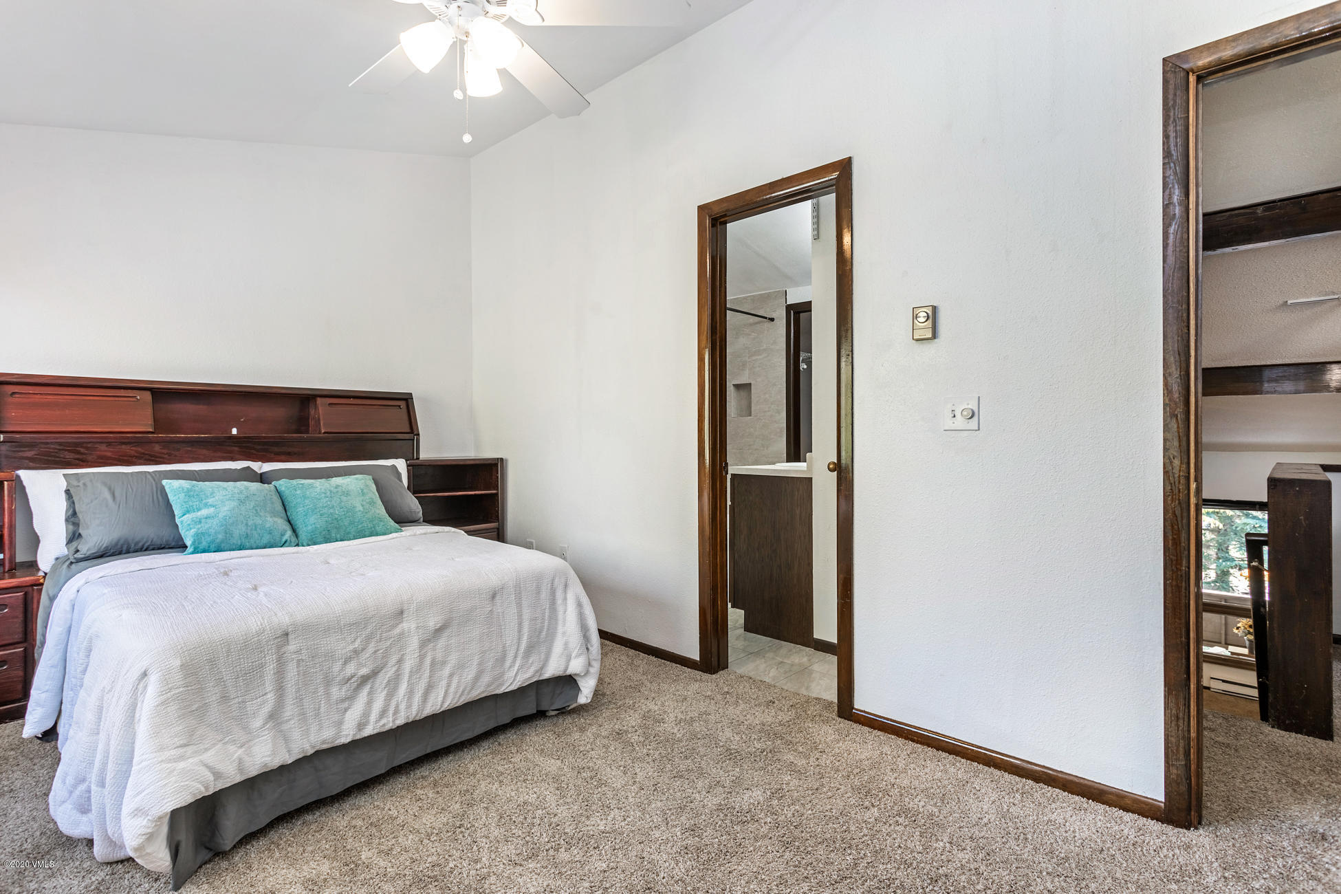 225 Gopher Road, Unit H54 Avon, CO 81620 - Photo 20 of 33 a bedroom with a bed and a mirror