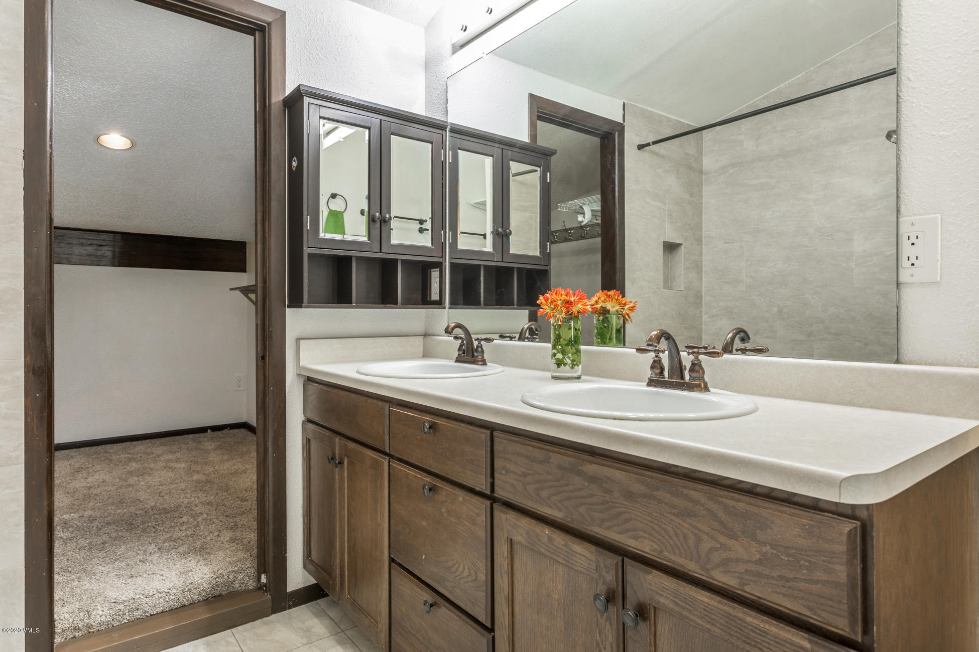 225 Gopher Road, Unit H54 Avon, CO 81620 - Photo 21 of 33 a bathroom with a sink and a mirror