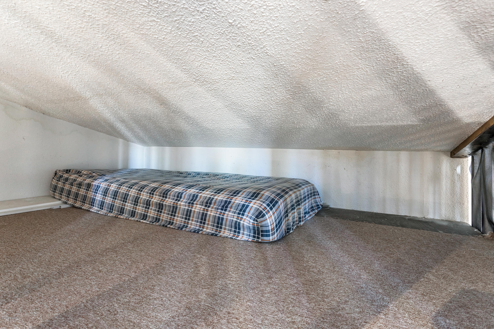 225 Gopher Road, Unit H54 Avon, CO 81620 - Photo 23 of 33 a bedroom with a bed and a cabinets