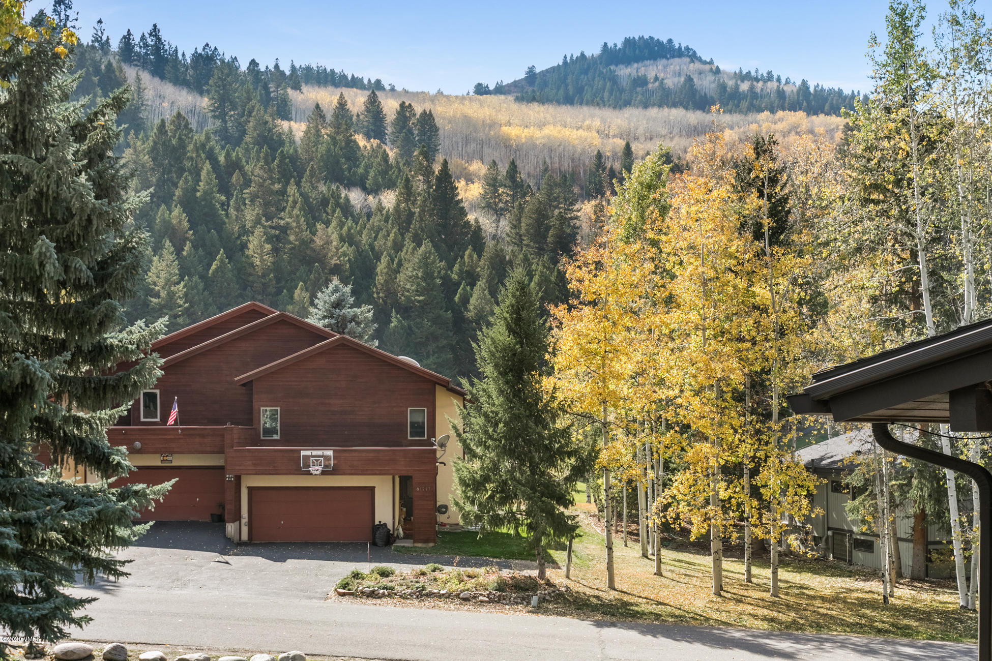 225 Gopher Road, Unit H54 Avon, CO 81620 - Photo 24 of 33 a front view of a house with a yard and mountain view in back