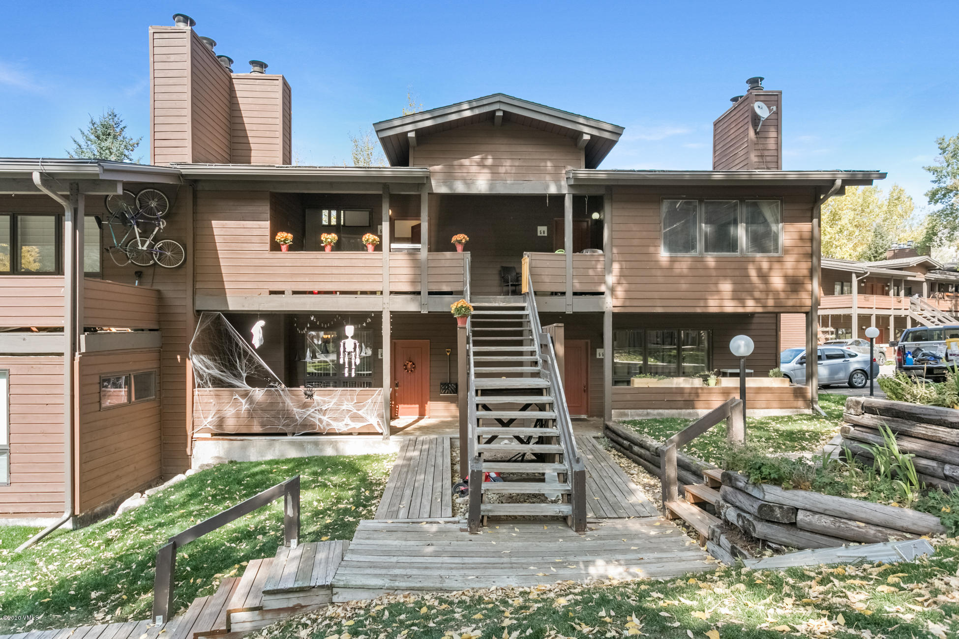 225 Gopher Road, Unit H54 Avon, CO 81620 - Photo 25 of 33 a front view of a residential apartment building with a yard