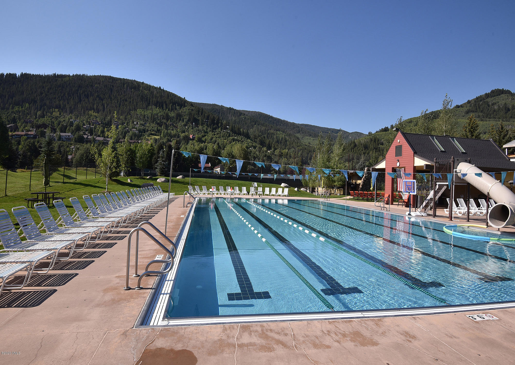 225 Gopher Road, Unit H54 Avon, CO 81620 - Photo 32 of 33 a view of a swimming pool with a table and chairs