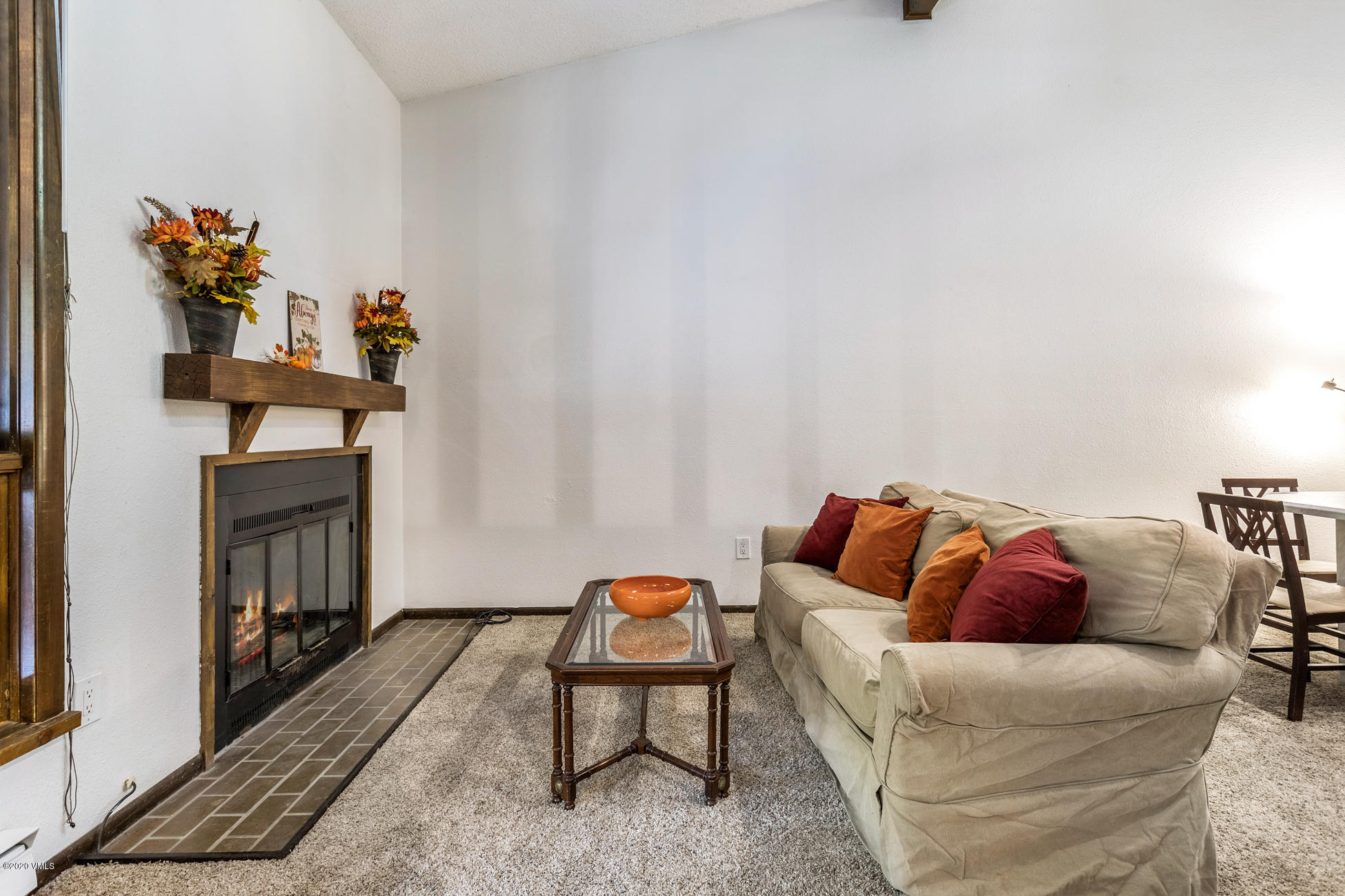 225 Gopher Road, Unit H54 Avon, CO 81620 - Photo 6 of 33 a living room with furniture and a fireplace
