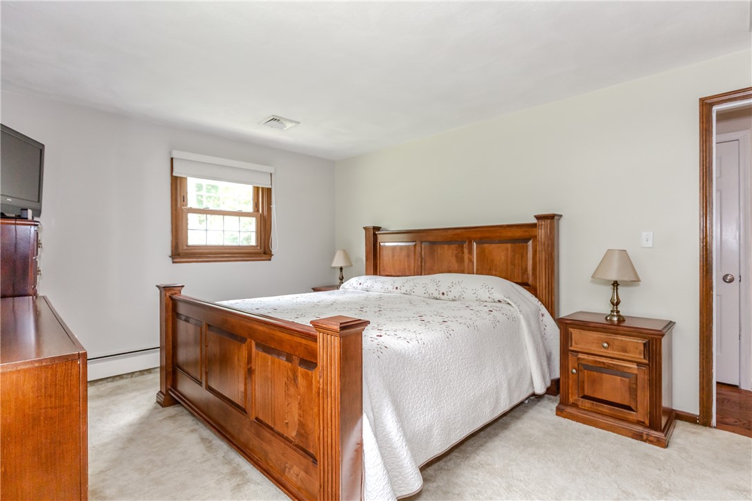99 Tower Hill Road Cumberland, RI 02864 - Photo 18 of 43 Spacious master bedroom offering plenty of room for comfort and relaxation.