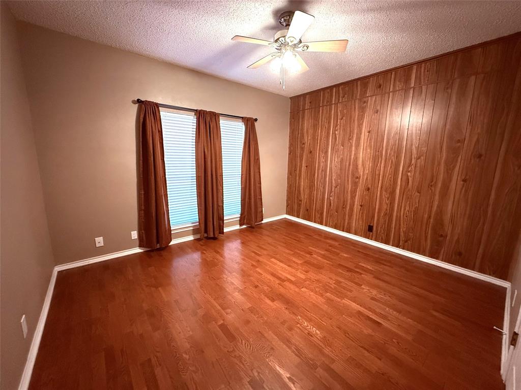 12098 Squirrel Road Pittsburg, TX 75686 - Photo 25 of 37 wooden floor in an empty room with a window