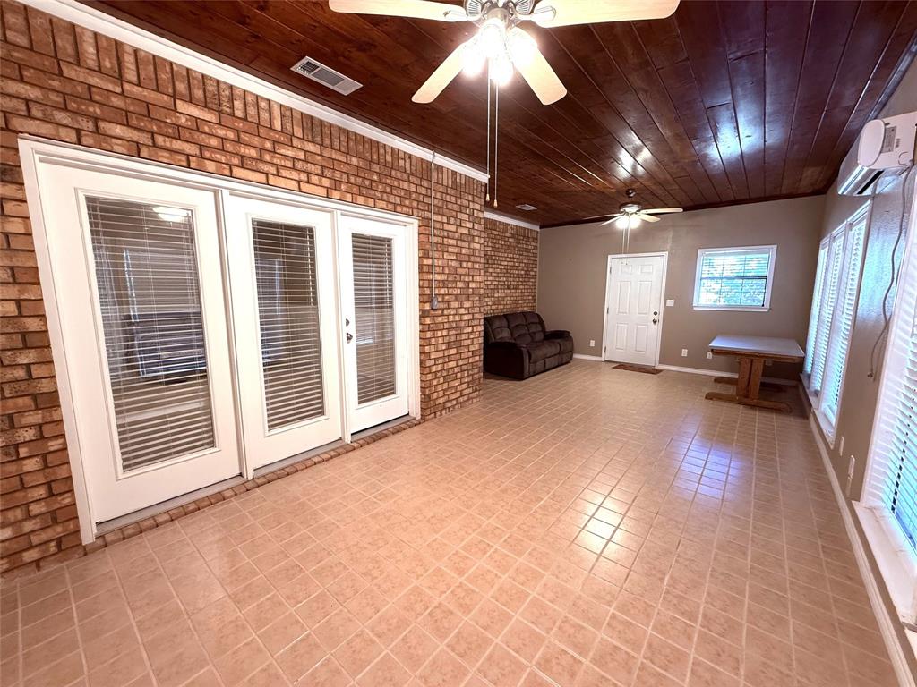 12098 Squirrel Road Pittsburg, TX 75686 - Photo 27 of 37 a view of a livingroom with furniture and chandelier fan