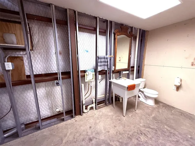 a bathroom with a sink and mirror