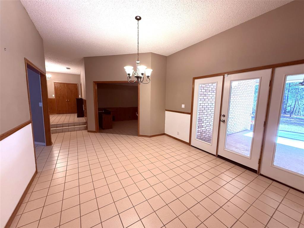 12098 Squirrel Road Pittsburg, TX 75686 - Photo 5 of 37 a view of a livingroom with a chandelier