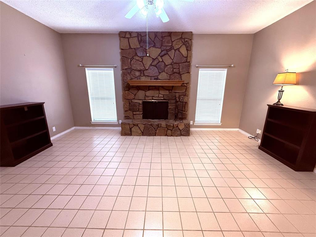 12098 Squirrel Road Pittsburg, TX 75686 - Photo 8 of 37 a living room with a fireplace
