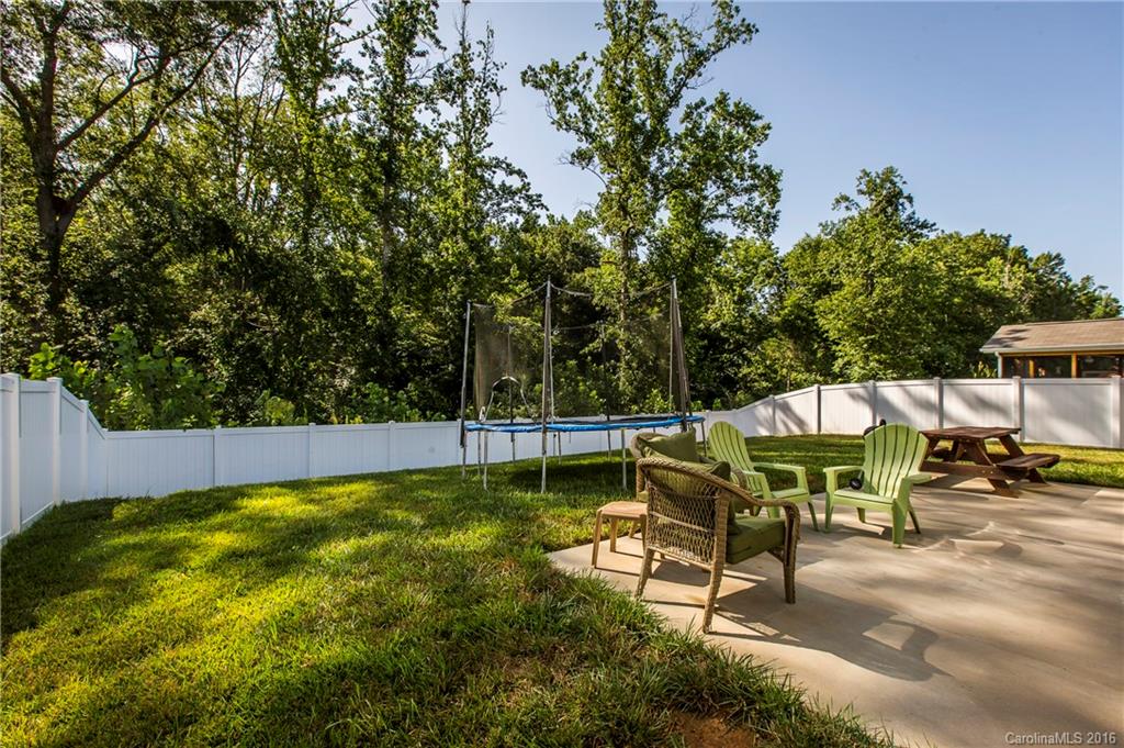 1621 Beleek Ridge Lane Clover, SC 29710 - Photo 22 of 24 a view of a swimming pool with a bench and trees
